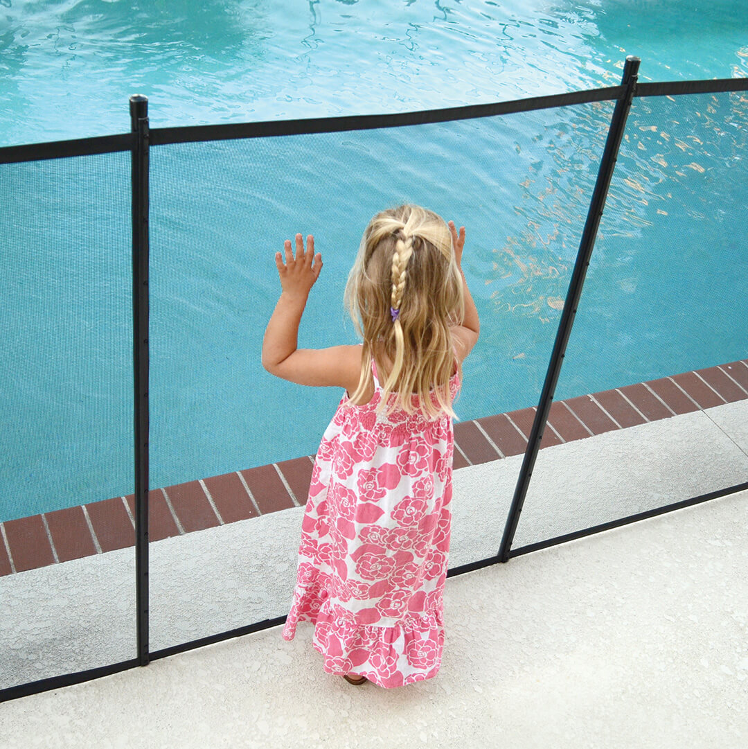 Child Pushing on a Mesh Pool Fence